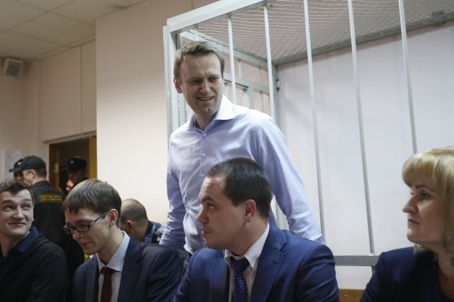 Maxim Zmeyev / Reuters Russian opposition leader and anti-corruption blogger Alexei Navalny arrives at a court hearing in Moscow, Dec. 19, 2014.