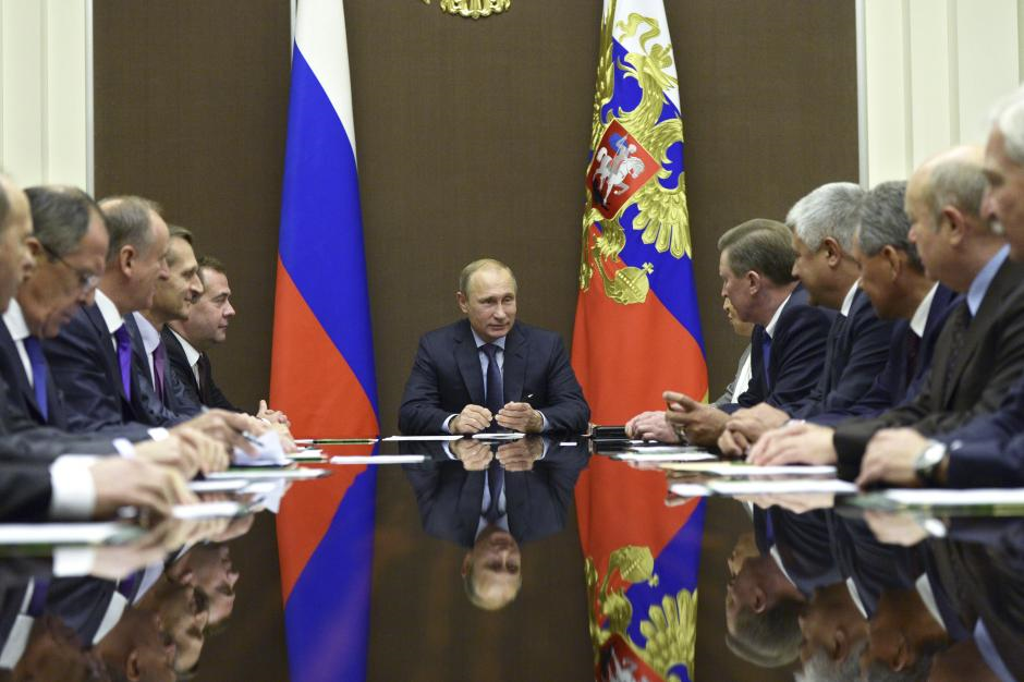 Russia's President Vladimir Putin chairs a meeting of the Security Council. One European expert estimates that at least a third of Russia's diplomats work for Putin's intelligence agencies. Alexei Nikolskyi/RIA Novosti/Kremlin/Reuters