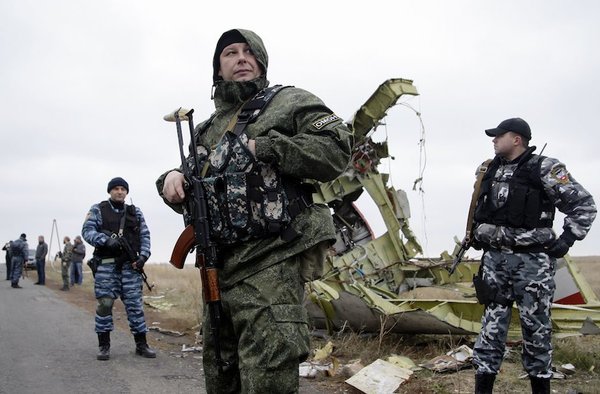 Alexander Ermochenko/epa/Corbis Pro-Russian rebels stand guard at the crash site of Malaysian Airlines jet MH-17 near Donetsk, Ukraine, November 11, 2014 