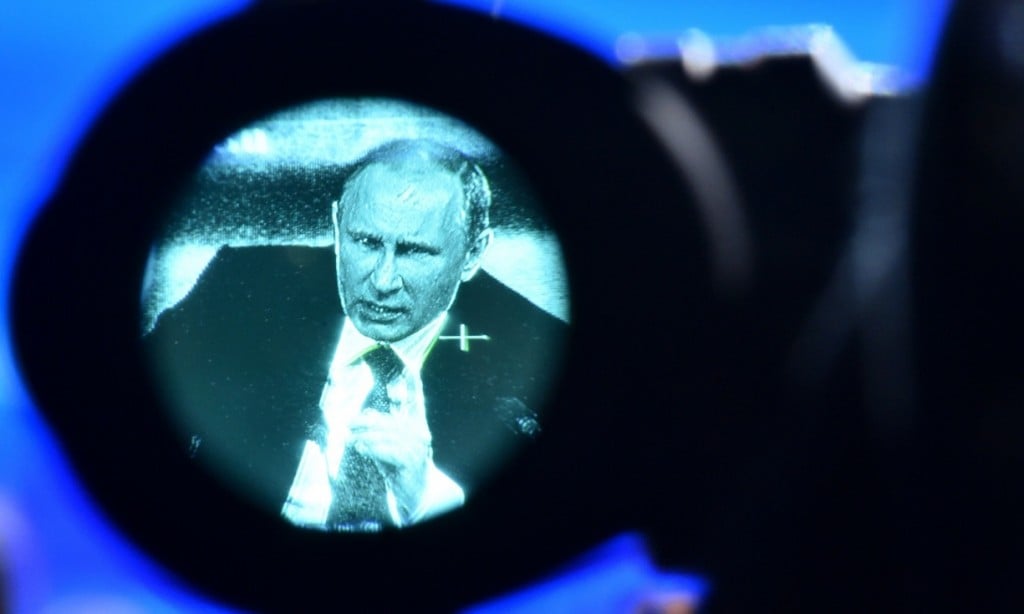 Vladimir Putin, seen through a viewfinder, at his annual press conference in Moscow in December 18, 2014. Photograph: Kirill Kudryavtsev/AFP/Getty Images 