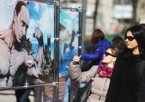 MOSCOW, RUSSIA. MARCH 16, 2015. Posters on display at an exhibition titled "Crimea. The return to its native harbor" in Moscow's Novopushkinsky Park. The exhibition marks the 1st anniversary of the 2014 Crimean status referendum. Sergei Fadeichev/TASS Ðîññèÿ. Ìîñêâà. 16 ìàðòà. Íà âûñòàâêå ãðàôè÷åñêèõ ðàáîò "Êðûì. Âîçâðàùåíèå â ðîäíóþ ãàâàíü", ïîñâÿùåííîé ãîäîâùèíå ðåôåðåíäóìà â Êðûìó, â Íîâîïóøêèíñêîì ñêâåðå. Ñåðãåé Ôàäåè÷åâ/ÒÀÑÑ