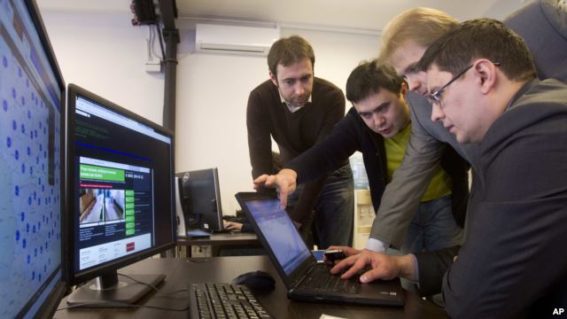 IT specialists set up a computer system at the "Elections 2012" situation center in Moscow, March 3, 2012.