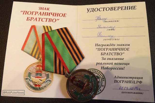 Graham Phillips' actual award: a medal and certificate dated March 1st - a "Distinction" for "support of Novorossiya" 