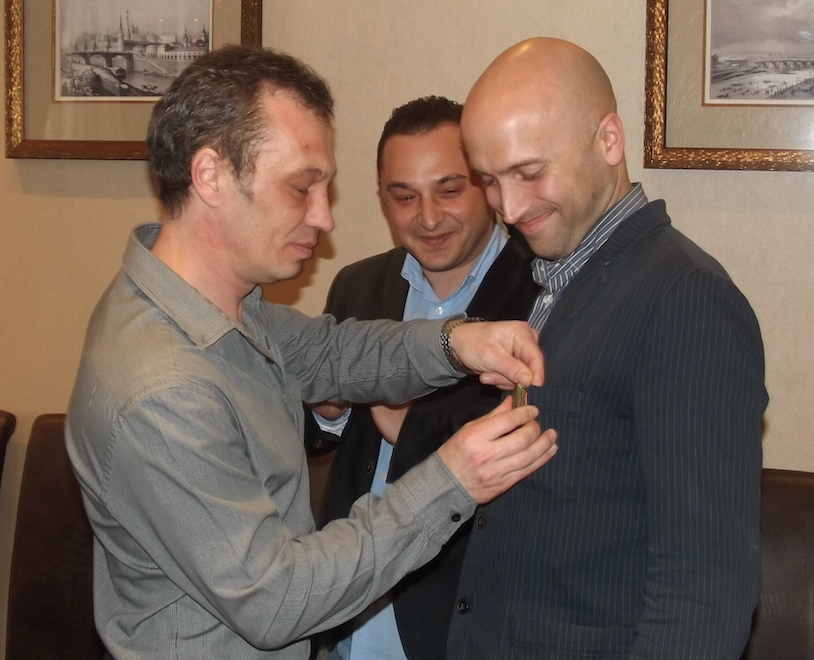 Border Guard of  the FSB of the Russian Federation medal awarded to Graham Phillips in Chekhov, Russia, March 2nd, 2015 by Pavel Hlyupin (Pavel Semchuck in centre) - Source permalink VK post