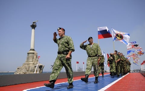 Russian marines march along the embankment of Sevastopol, Crimea, during a celebration of the Navy Day on Sunday, July 26, 2015. (AP Photo/ Alexander Polegenko)