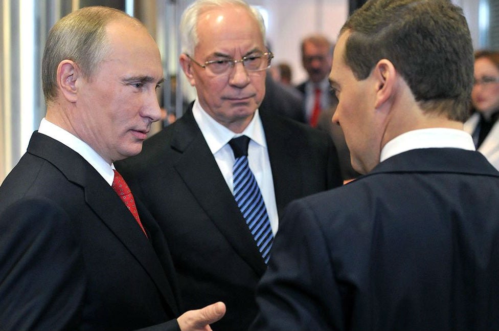 Russian President Vladimir Putin and Russian Prime Minister Dmitry Medvedev at a meeting with former Ukrainian Prime Minister Mykola Azarov on May 26, 2012 in Moscow, Russia. On August 3, Azarov—now living in exile in Moscow—formed the “Ukraine Salvation Committee,” whose goal is “regime change” back home. Azarov is wanted in Ukraine for several crimes including embezzlement and abuse of power. Credit: Kremlin.ru