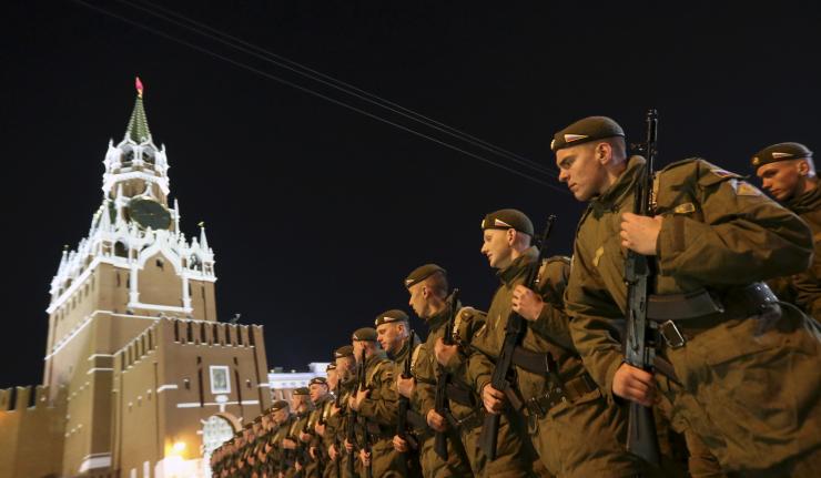 A former Russian internet troll who posted pro-Kremlin propaganda online was awarded one ruble in damages in a labor dispute. In this photo, Russian servicemen march during a rehearsal for the Victory parade, with the Kremlin's Spasskaya (Saviour) Tower seen in the background, on Moscow's Red Square on May 4, 2015. Reuters/Sergei Karpukhin 