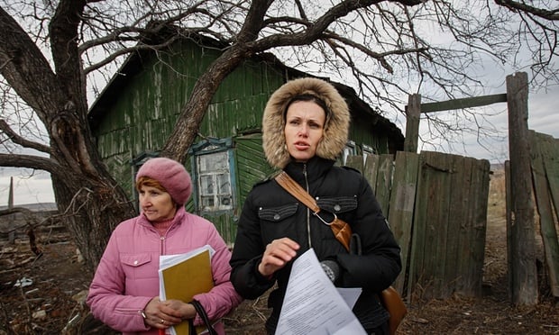 Kutepova (right) stands with a villager in Muslyumovo, one of Russia’s most lethal nuclear dumping grounds. Photograph: Denis Sinyakov/Greenpeace/The Moscow Times 
