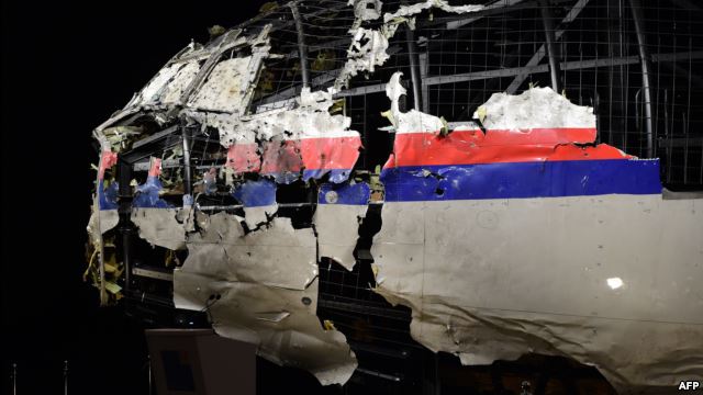 The wrecked, reconstructed cockpit of Malaysia Airlines flight MH17 is exhibited during a presentation of the final report by the Dutch Safety Board on the cause of the crash.