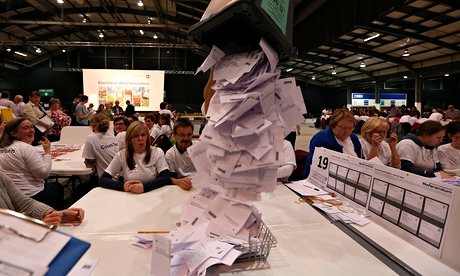 Ballot boxes are opened as counting begins in the Scottish referendum in Aberdeen. Photograph: Scott Heppell/AP 