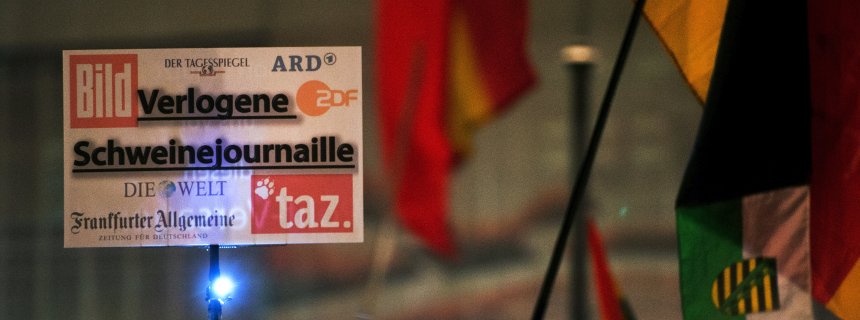 "Mendacious swine journals" reads this sign held by a German protester at a recent PEGIDA demonstration in Dresden, listing various German media outlets