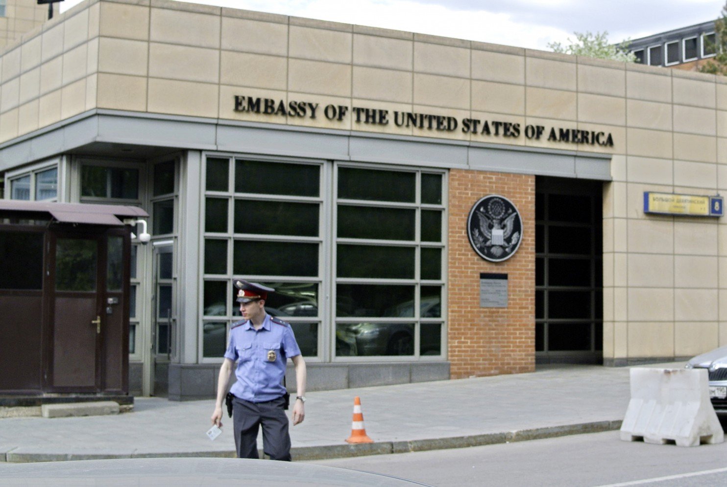 A Russian policeman stands in front of an entrance of the U.S. Embassy in Moscow in 2013. (Ivan Sekretarev/Associated Press)