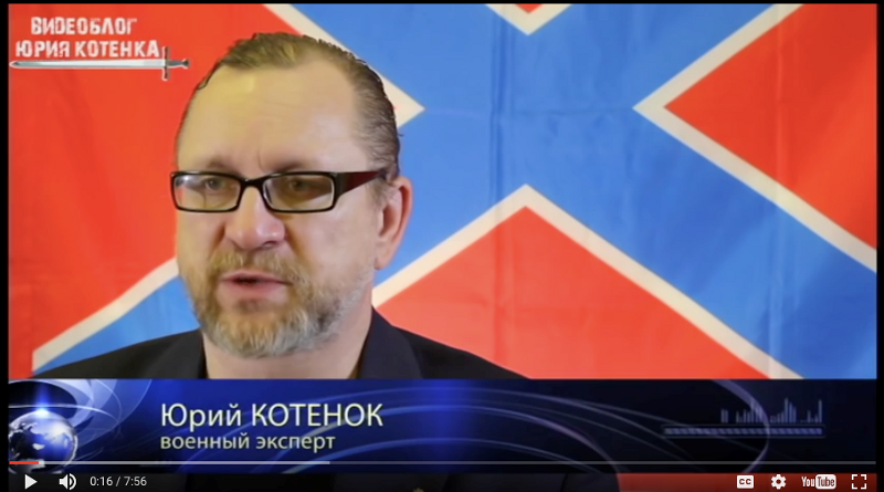 Screen shot of Kotenok, as a “military expert”, in front of a flag often used by separatists
