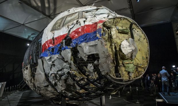 The reconstructed wreckage of the MH17 airplane is seen after the presentation of the final report into the crash of July 2014 of Malaysia Airlines flight MH17 over Ukraine, in Gilze Rijen, the Netherlands, October 13, 2015. REUTERS/Michael Kooren SEARCH - PICTURES OF THE YEAR 2015 - FOR ALL IMAGES TPX IMAGES OF THE DAY