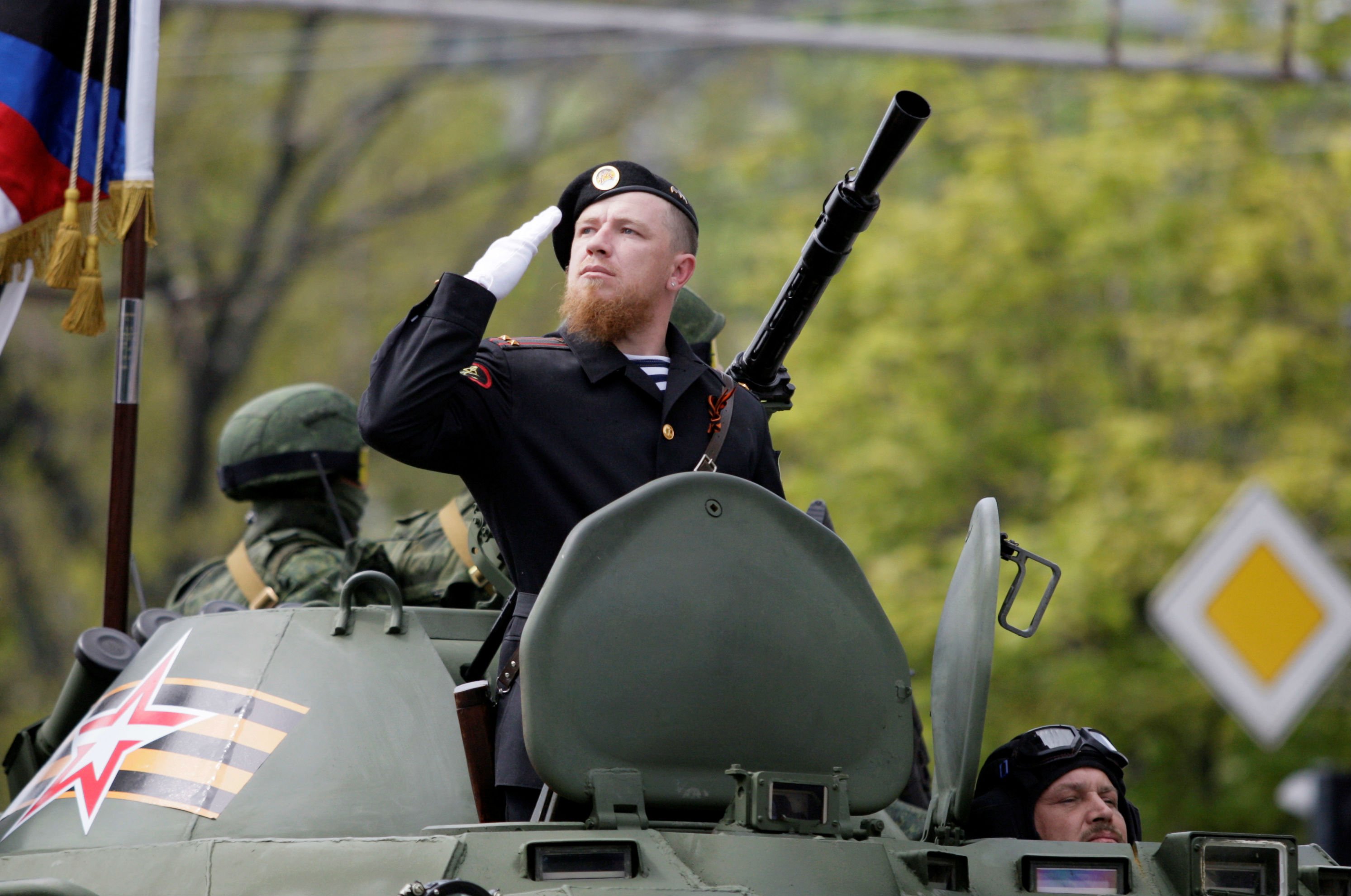 Former Russian militant leader Arsen Pavlov, call sign "Motorola," sits atop of an armored personnel carrier during the Victory Day parade, marking the 71st anniversary of the victory over Nazi Germany in World War Two, in Donetsk, Ukraine, May 9, 2016. REUTERS/Alexander Ermochenko